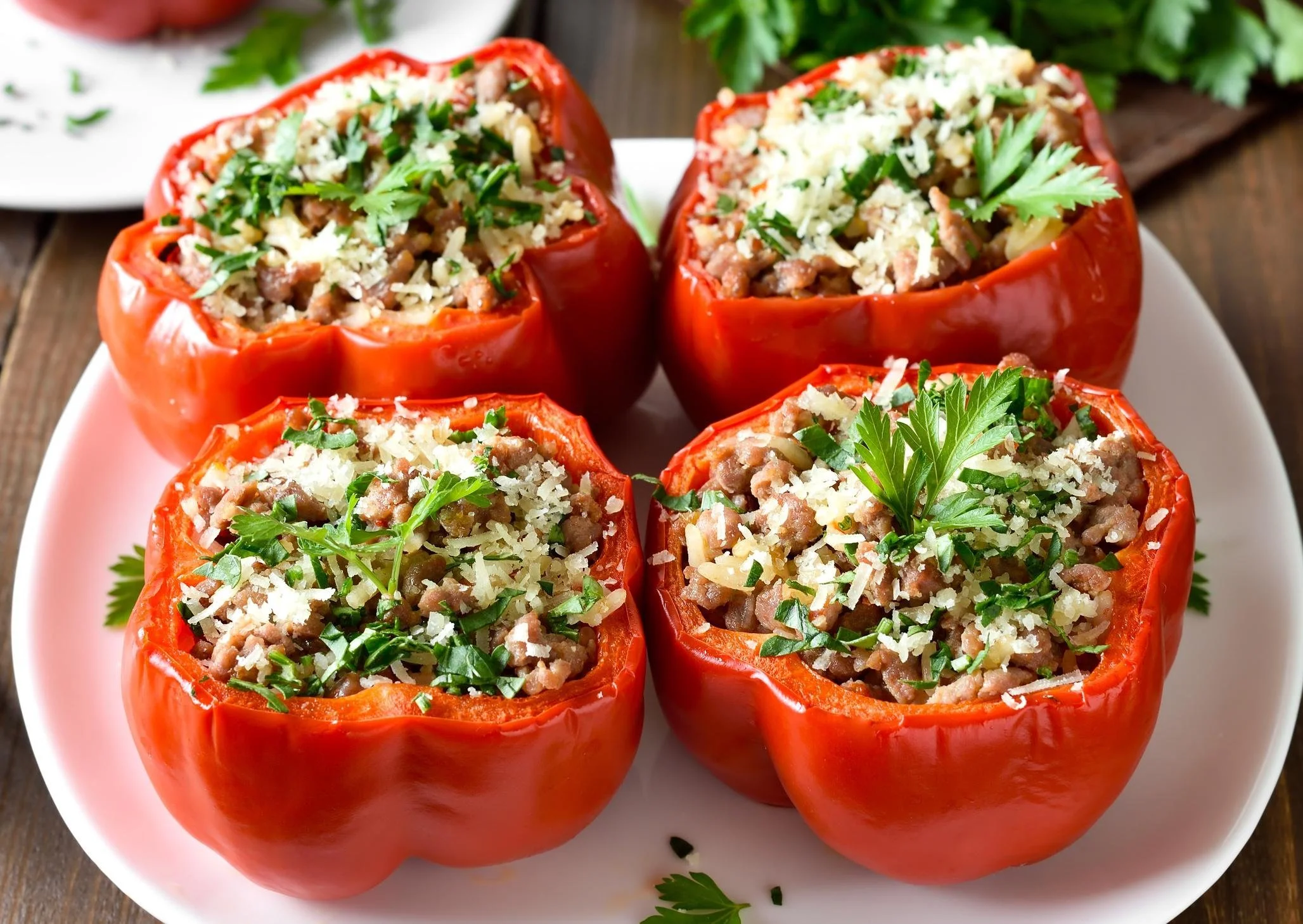 Plate of authentic stuffed peppers filled with rice, meat, and spices