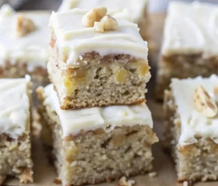 Delicious banana bread brownies with chocolate and banana on a wooden plate