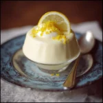 Delicious lemon mousse served in a glass with a slice of lemon on top
