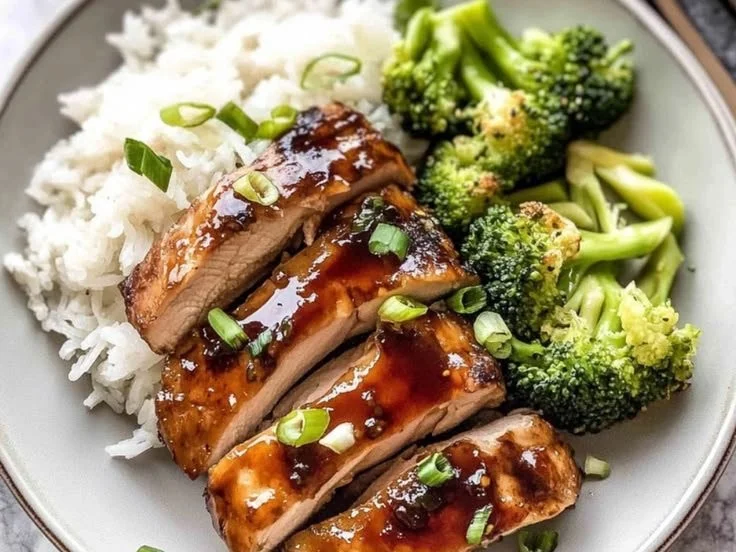 Delicious teriyaki chicken garnished with sesame seeds and green onions