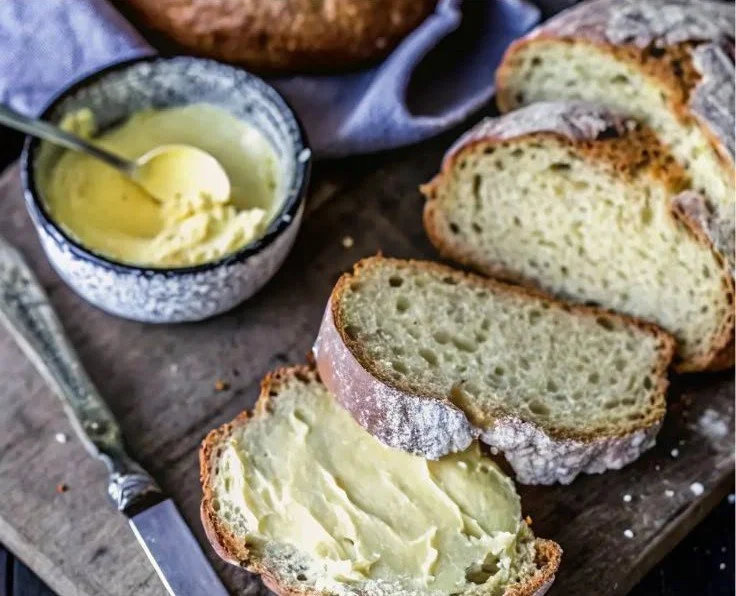 Loaf of Traditional Irish Soda Bread on a wooden cutting board