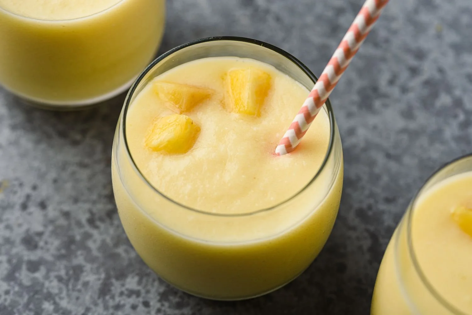 Delicious pineapple coconut smoothie in a tropical setting