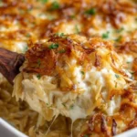 French onion chicken orzo casserole topped with melted cheese