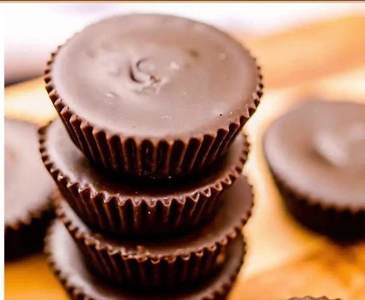 Homemade Chocolate Peanut Butter Cups 3 Delicious homemade chocolate peanut butter cups on a white plate