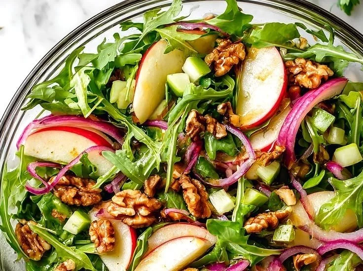Simple celery apple salad with fresh ingredients in a bowl.