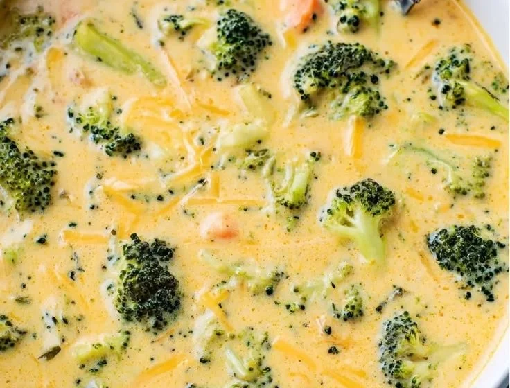 Creamy Broccoli Cheddar Soup served in a bowl with parsley garnish